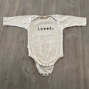EUC ‘Loved’ longsleeved bodysuit
